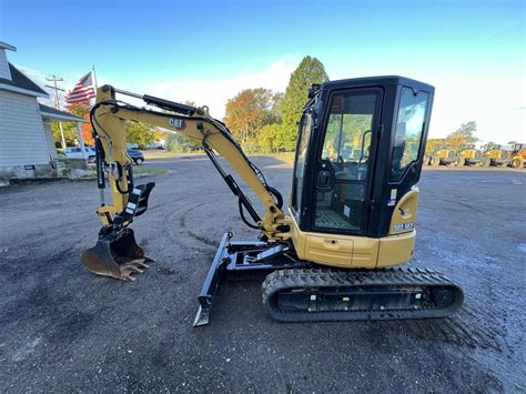 cat mini excavator through glass store|496.